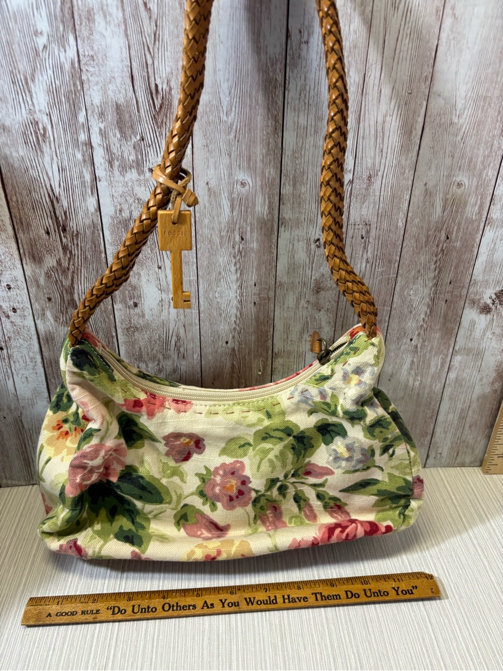 Fossil floral pebble shoulder bag with fossil key